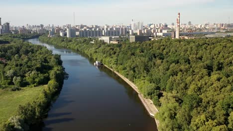 Air-view-of-the-metropolis-on-a-summer-day-from-the-floodplain-of-the-river-and-green-areas