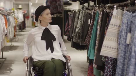 Woman-in-Wheelchair-Shopping-for-Skirt-in-Clothing-Store