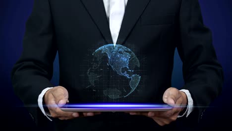 4K.-businessman-in-black-suit-holding-tablet-computer-with-blue-digital-hologram-of-world-revolves-above-on-tablet-screen