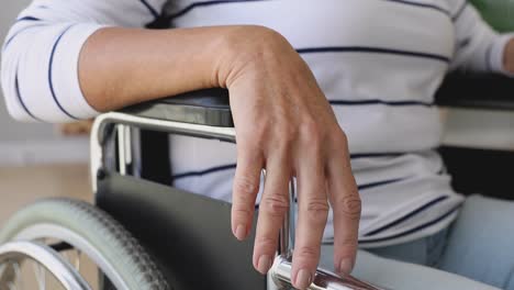 Handicapped-disabled-old-woman-sit-on-wheelchair,-close-up-view