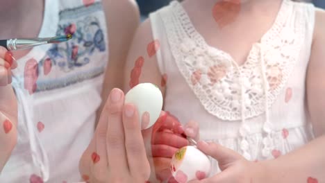 Mother-and-daughter-painting-easter-eggs