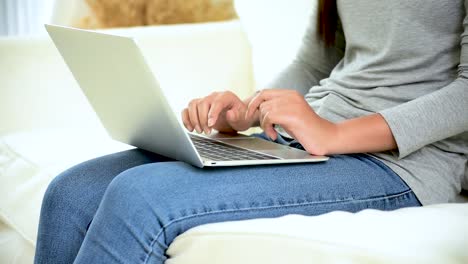 Asian-woman-using-tablet-computer-shopping-online-website-on-smartphone-with-smiling-face.-Happiness-asian-woman-holding-cellphone-checking-mail-from-online-shopping-website-read-article-Blog-vlog-social-media