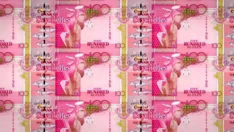 Banknotes-of-one-hundred-rupees-of-the-Seychelles-Island,-cash-money,-loop