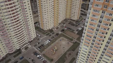 Aerial-view.-A-complex-of-new-high-rise-apartment-buildings-in-the-city.-Camera-approaching-buildings