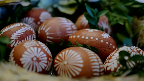 wax-and-onion-painted-easter-eggs-rack,-pull-focus