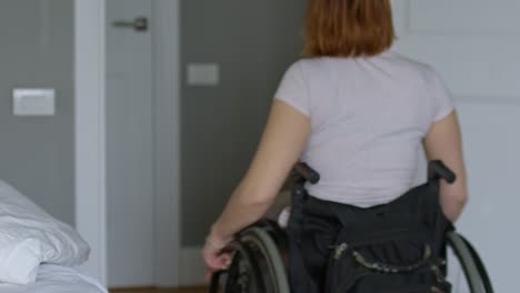 Woman-in-Wheelchair-Riding-out-Bedroom