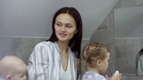 Toddler-with-Two-Mums-Washing-Hands-in-Bathroom