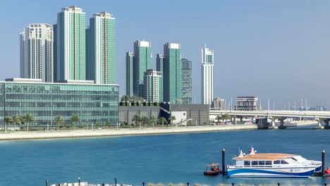 Modern-buildings-in-Abu-Dhabi-skyline-timelapse-with-waterfront