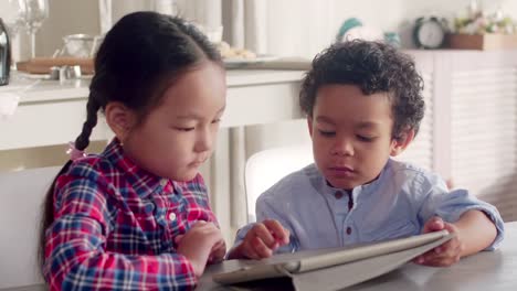 Mixed-Raced-Kids-Using-Tablet-Together