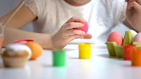 Child-painting-color-eggs-brush,-decorating-Easter-symbol,-preparation-festival