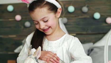 Close-up-of-cute-girl-stroking-the-rabbit