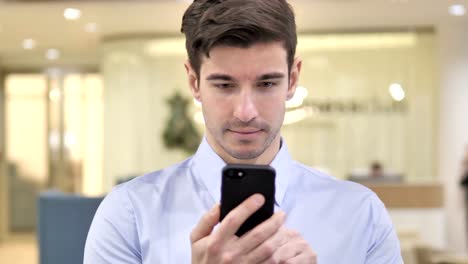 Businessman-Typing-Message-on-Smartphone