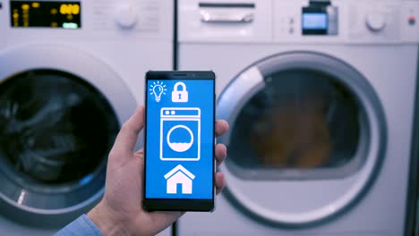 App-on-mobile-phone-controls-washing-machine-in-smart-home