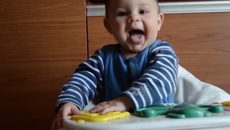 Cute-six-months-old-baby-boy-playing-with-artificial-basket-with-eggs-and-droping-it---easter-egg-hunt