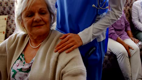 Front-view-of-active-senior-woman-holding-hand-of-female-doctor-at-nursing-home-4k