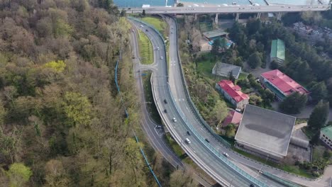 Aerial-video-shooting.-Transport-interchange-along-the-black-sea-coast-in-Sochi.-Evening-light-over-the-horizon-of-the-sea.-Panorama-shooting.-Blue-water.-resort-of-Russia.