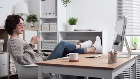 Young-Woman-Procrastinates-Scrolling-her-Smartphone