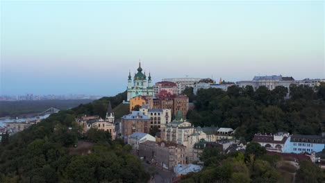 Aerial-view-of-St.-Andrew's-Church,-Richard's-Castle-and-the-famous-St.-Andrew's-Descent,-where-artists-exhibited-their-work,-Podil,-Kyiv