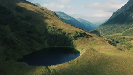 Aerial-view;-drone-moving-over-mountain-lake