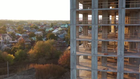 Flight-over-the-construction-site,-at-dawn,-4k-drone-view