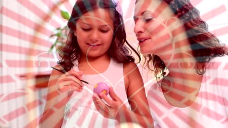 Mother-and-daughter-painting-easter-eggs