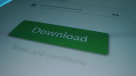 Close-up-Macro-Shot:-Touch-Screen-Device-with-Open-App-Showing-"Download"-Button,-Finger-Presses-on-the-Button.-Content-Downloading-Software.-Mock-up-Application-with-Material-Design-UI,-UX,-GUI