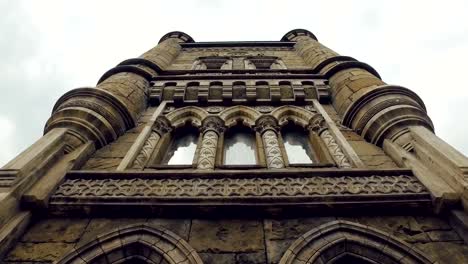 facade-of-tower-of-building-in-gothic-renaissance-style,-stained-glass-windows,-bas-reliefs