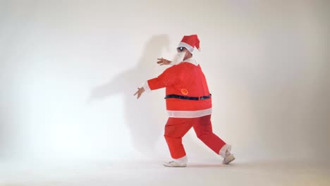 Junior-funny-thin-Santa-Claus-dancing-and-having-fun.