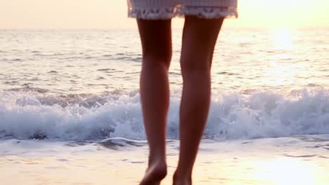 legs-young-Caucasian-female-healthy-outdoor-lifestyle-walking-beach-coast-tropical-living-travel-barefoot-ocean-shallows