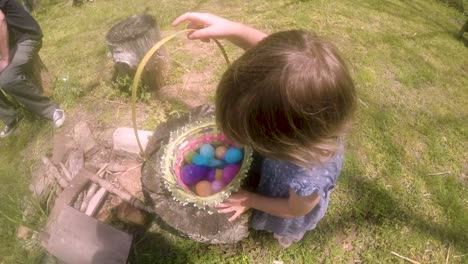 POV-of-a-mother-with-her-daughter-and-Easter-eggs-in-a-basket