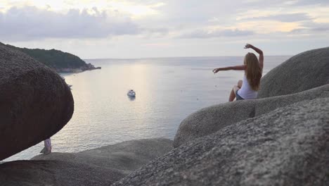 Woman-Sitting-on-Rocks