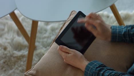 Female-touching-blank-screen-of-tablet-with-hands