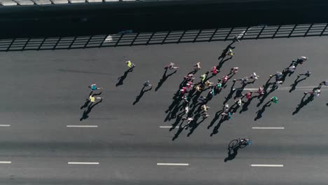 4k-Aerial-drone-fooage.-Marathon-running-on-street.-Following-Group-of-athletes.-Top-view