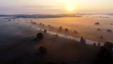 Aerial-footage-video-of-foggy-morning.-Flying-over-the-Desna-river.-Sunrise-time.-Kyiv-region,-Ukraine.