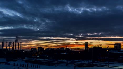 running-sunset-clouds-and-city-skyline;-time-lapse