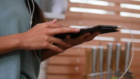 Close-Up-hand-of-asian-young-woman-using-tablet.-technology,-social-network,-communication-concept-at-home.