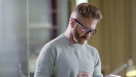 Bearded-Man-Using-Tablet-Computer