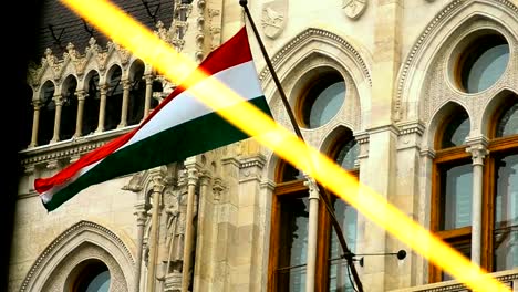 View-of-Hungarian-flag-through-rain-drops-on-window