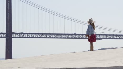 Girl-taking-photo-on-high-view-point-above-city