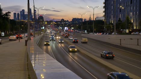 cars-drive-along-street-to-tunnel-traffic-interchange