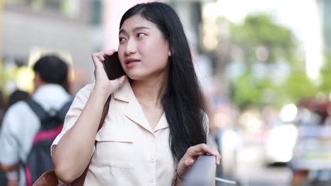 Asian-woman-using-mobile-phone