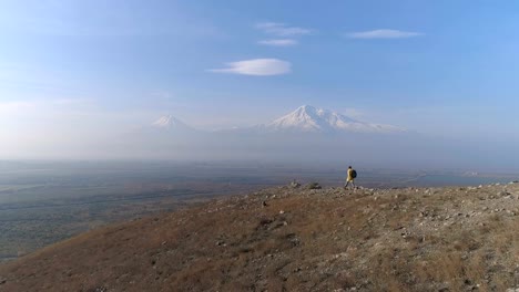 hiker-with-rucksack-in-colorful-jacket-go-to-look-at-beautiful-scene