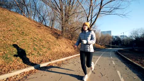 Outdoors-jogging-session-of-a-girl-with-a-robotic-hand