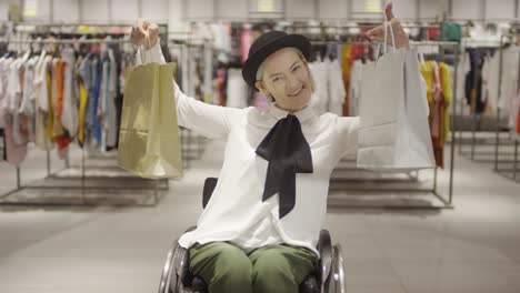 Paraplegic-Woman-Posing-with-Shopping-Bags-in-Clothing-Store