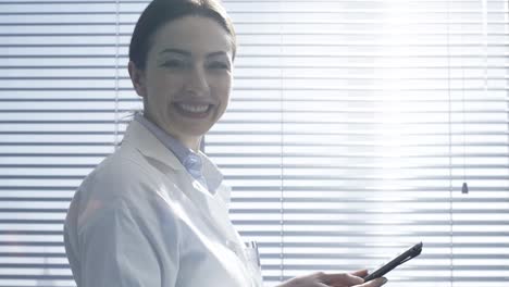 Professional-female-doctor-using-a-digital-tablet