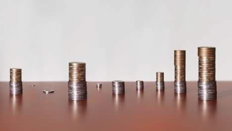 Many-coins-in-timelapse-on-the-wooden-table