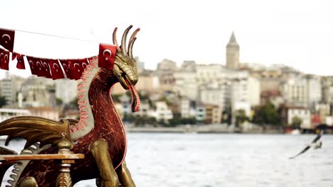 Tourist-boat-floating-in-Bosphorus-with-Galata-tower-and-Istanbul-cityscape-background