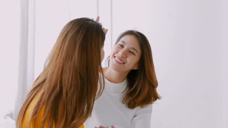 Beautiful-young-asian-lesbian-woman-couple-on-bedroom-at-home.-Concept-lgbt.