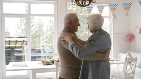 Joyous-Senior-Man-and-Woman-Dancing-at-Party