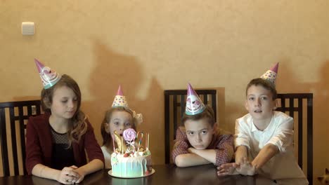 Children-boring-on-birthday-party.-birthday-cake-for-little-birthday-girl.